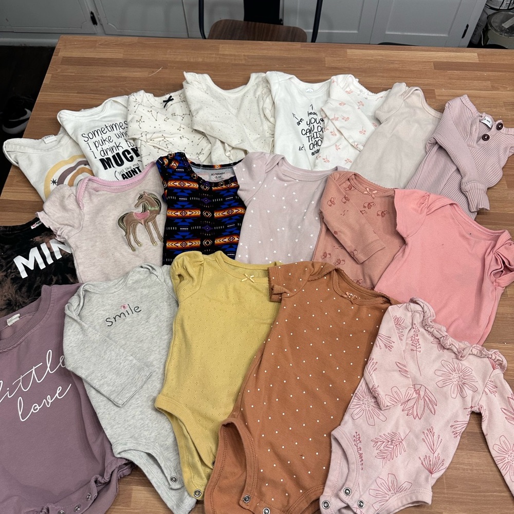 Assorted Baby Onesies in Various Colors